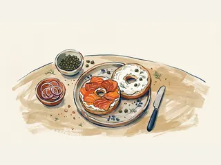 Dos mitades de bagel con queso crema y salmón se presentan con alcaparras y aros de cebolla.