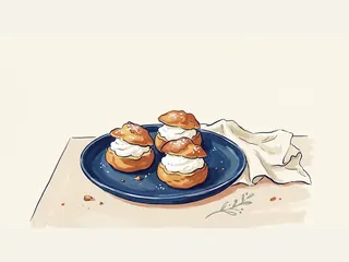 Tres bocaditos redondos de pasta choux rellenos de nata sobre un plato azul.