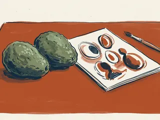 Dos aguacates enteros junto a una composición de óvalos pintados sobre papel.