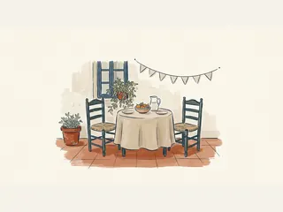 Una mesa con fruta, platos y una jarra de agua entre dos sillas de un patio decorado con una guirnalda.